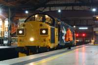 Newly returned to the mainline and going on hire to Colas, 37025 stops at Preston for a crew change on 18 January 2016 whilst working light engine from Bo'ness to Washwood Heath.<br><br>[John McIntyre 18/01/2016]