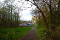 The lane shown in 53918 debouches (great word that!) at its west end into the site of the goods yard. EMU passing on the far left. [See image 53918].<br><br>[Colin Miller 23/04/2014]