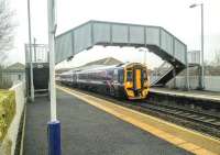 Scotrail's uniform 'Saltire' livery was unveiled in a blaze of publicity back in September 2008. Re-branding of the stock, which was already approximately the right colour, was slow and seems to have stopped altogether. 158726 still sports the older livery with the pink swoosh of the previous operator, First Group, at Dalmeny station on 19 January 2016.<br><br>[David Panton 19/01/2016]