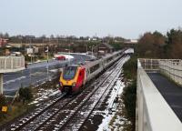 A Glasgow to Carlisle Voyager scurries past the current Gretna Green station and the previous Gretna Green station on the 18th of January 2016.<br><br>[Bruce McCartney 18/01/2016]