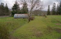 View of the former RNAD depot, and its platform, at Fort Augustus. This was just south of the station on the east side of the line. This view looks south in 2000.<br><br>[Ewan Crawford //2000]