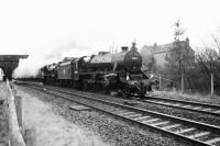 Getting back into their stride after a water stop at Hellifield are Black 5s 44871 and 45407 whilst working from Manchester to Carlisle. The duo are seen passing Long Preston getting ready for some hard work on the climbs north of Settle Jct.<br><br>[John McIntyre 23/01/2016]