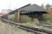 The abandoned Mersey Railway carriage depot at Birkenhead Central (BC), as seen from the station platform in November 2015. The third rails have been removed from the depot tracks but the siding alongside is still live and appeared to be used occasionally. The depot sits in a deep hollow so redevelopment of the site may not be straightforward. EMU maintenance on the Wirral side of the Mersey is now concentrated at Birkenhead North (BD).<br><br>[Mark Bartlett 16/11/2015]
