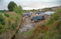 The 'throat' of Lesmahagow station in 2000. The passenger station, a single platform, was on the line continuing south and curving off to the left to cross a viaduct whilst the goods yard sidings were straight ahead. This was the second Lesmahagow station, the first being renamed Brocketsbrae. This one was, at least, in Lesmahagow. The cutting here has since been largely infilled.<br><br>[Ewan Crawford //2000]