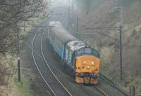 Heading for the first stop at Lancaster, 37409 <I>Lord Hinton</I> is seen between Scorton and Bay Horse running through the cutting at Forton with the 1005hrs (M-F) Preston to Barrow service. <br><br>[Mark Bartlett 19/01/2016]