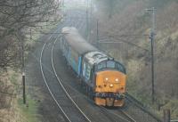 Heading for the first stop at Lancaster, 37409 <I>Lord Hinton</I> is seen between Scorton and Bay Horse running through the cutting at Forton with the 1005hrs (M-F) Preston to Barrow service. <br><br>[Mark Bartlett 19/01/2016]