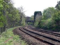 This is one of a series of 'record' photographs taken of the South Suburban line in 2002 before major track renewal works.<br>
<br>
The location is about 300 yards to the east of the access point off Cluny Avenue in Morningside. On the left of the picture over the fence is the Jordan Burn. OB13 Oswald Road is visible in the background with signal ES670R adjacent. Blackford Hill itself is visible in the background through the trees above the bridge.<br><br>[Charlie Niven 25/04/2002]