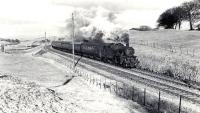 Fairburn tank 42056 passing Shilford with the 5.12pm Glasgow - Uplawmoor train on 27 March 1962. The joint line can be seen top left passing through Shilford Gap at the top of Neilston bank.<br><br>[G H Robin collection by courtesy of the Mitchell Library, Glasgow 27/03/1962]