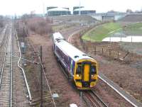 A 158 DMU approaching Newcraighall North Junction on an overcast 19 January 2016. The train is the 1045 (Sunday) Tweedbank - Edinburgh Waverley.<br><br>[John Furnevel 19/01/2016]