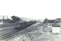 EE Type 1 D8107 passing Balornock Shed on the original line in August 1963 with a consignment of stock for the works.<br><br>[G H Robin collection by courtesy of the Mitchell Library, Glasgow 29/08/1963]