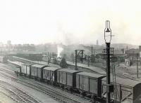 General view over Buchanan Street station on a grey afternoon in April 1954. In the centre of the picture Black 5 no 44980 is about to depart with the 1.45pm to Inverness.  <br><br>[G H Robin collection by courtesy of the Mitchell Library, Glasgow 21/04/1954]