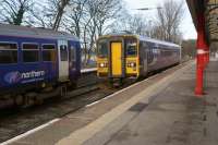 A Northern Class 153 arrives at Lancaster with a service from Morecambe on 30 January 2016. On the adjacent platform there were two Class 153s stabled between services.<br><br>[John McIntyre 30/01/2016]