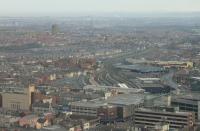 Panorama of Blackpool North station, as seen from the Tower in January 2016. In the foreground the grey car park with the <I>Wilko</I> sign occupies the site of the old Blackpool Talbot Road station and will be replaced by the new tram terminus (See recent news item). The present day station uses the old excursion platforms and beyond them, and Blackpool No.2 signal box, the maintenance depot sidings can be seen with a trio of Northern DMUs present. The prominent landmark is the Warbreck water tower whilst upper left Heysham Power Station can also be seen, illustrating what an amazing viewpoint the Tower provides on a clear day.<br><br>[Mark Bartlett 16/01/2016]