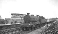 Robinson O4 2-8-0 no 63730 clatters south through Doncaster on 6 July 1963 with a rake of mineral wagons.<br><br>[K A Gray 06/07/1963]