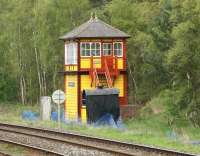 The 'Midland Type 2B' signal box alongside Armathwaite station, photographed in May 2006. Originally manufactured in kit form at the Midland Railway's signalling workshops in Derby, the box was assembled on this site in 1899 as a replacement for an earlier structure which had been destroyed by fire. Closed in January 1983 it is still owned by Network Rail, but in 1992 was leased to the 'Friends of the Settle & Carlisle Line', who have since restored it to original MR appearance.<br><br>[John Furnevel 06/05/2006]