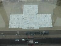 <I>Flexity</I> tram heading south on the Promenade at Blackpool, as seen through the glass floor of the Tower. The tram is passing the <I>Comedy Carpet</I>, a large mosaic of catchphrases and jokes by famous comedians. Footnote: Ruggish? - The Eric Morecambe response to 'What do you think of it so far?'<br><br>[Mark Bartlett 16/01/2016]