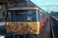 303028, recently arrived at Milngavie station, waits for passengers while the driver changes ends.<br><br>[Ewan Crawford //1988]