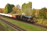 Stanier LMS 8F 2-8-0 48624, with the GCR's <I>Windcutter</I> rake of 16T mineral wagons that are used for demonstration freight workings. <br><br>[Peter Todd 29/01/2016]