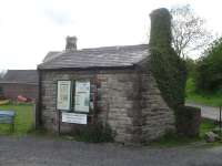 What would appear to be a former weighbridge building stands in the yard by Redmire station, as seen in May 2015  <br><br>[David Pesterfield 25/05/2015]