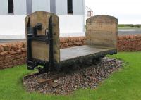 Outside the Devil's Porridge museum in Eastriggs are two railway exhibits. The camouflage painted standard gauge 0-6-0 fireless locomotive is very visible from the road [See image 48483] but this narrow gauge wagon on the other side of the building might be overlooked. As the Longtown-Gretna-Eastriggs complex was nine miles long with a fleet of over forty locomotives there must have been hundreds of railway wagons in use there at the height of munitions production.<br><br>[Mark Bartlett 31/01/2016]