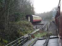 BR Sulzer Type 2 D7628 rounds the curve alongside the north end of the NYMR carriage sidings at Grosmont in December 2015, as it approaches the Esk Valley line station with a Santa Special working from Whitby to Glaisdale. BR Standard 76079 was assisting on the rear of the rake, plus providing copious amounts of steam heating, and hauled the service back to Whitby interspersed with a water top up stop at Grosmont Station. <br><br>[David Pesterfield 13/12/2015]