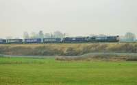 DRS Class 66s 66427 and 66305 take the <I>Tesco Express</I> north near Bay Horse on 19th January 2016. <br><br>[Mark Bartlett 19/01/2016]