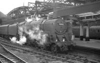 The unusual sight of BR Standard class 9F 2-10-0 no 92034 at Newcastle Central with a passenger train on the afternoon of Saturday 22 July 1961. The train in question is the 12.30pm ex Kings Cross.<br><br>[K A Gray 22/07/1961]