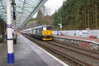 The empty sleeper stock working inbound from Polmadie to Oban rolls through Dalmally on 14 February 2016 hauled by 73967 with 73968 on the rear. The refurbishment of the locomotives dedicated for the West Highland sleeper included the fitting of snow ploughs in anticipation of future winter journeys over Rannoch Moor.  <br><br>[Malcolm Chattwood 14/02/2016]