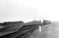 Ex-GER 2-4-0T 67164 approaching the platform at Kirkton Bridge Halt shortly after leaving Fraserburgh with a train for St Combs in July 1951.  <br><br>[G H Robin collection by courtesy of the Mitchell Library, Glasgow /07/1951]