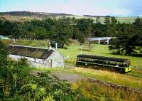 In August of 1964 a railbus leaves Blacksboat station westbound. The view gives a good general view of the station's situation. The goods shed is off to the right. [See image 54234]. The bridge in the background crosses the River Spey, today carrying the B9138.<br><br>[Andrew Saunders /08/1964]