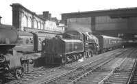 Upperby shed's Ivatt 2-6-0 43004 alongside platform 4 at Carlisle on 24 August 1963 with an unidentified working.<br><br>[K A Gray 24/08/1963]