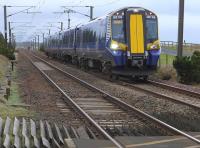 380 106  approaches Gailes level crossing, south of Irvine, with an Ayr-Glasgow Central service.  Gailes Station was situated to the rear of the train and closed on 2 January 1967.<br><br>[Bill Roberton
 09/02/2016]