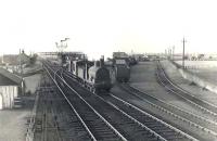 Caley 'Jumbo' 57355 runs south through Barassie on 7 July 1954 with a pair of brake vans.  <br><br>[G H Robin collection by courtesy of the Mitchell Library, Glasgow 07/07/1954]