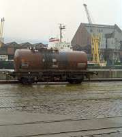 A TTA with a buckled spring sits in the dockside siding used for 'cripples' from the United Molasses depot.<br><br>[Ewan Crawford //1989]