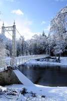 The suspension bridge at Cambus 'O May which gave access from south bank of river Dee to the railway station throughout GNoSR, LNER and BR days. Sadly damaged in the December 2015 storms/floods. From a quick look main suspension cables, end towers and anchor blocks OK. Deck needs remedial work.<br><br>[Brian Taylor 13/02/2016]