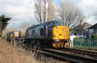 DRS 37716 hauls two nuclear flasks, and classmate 37610, towards Morecambe through Bare Lane on 18th February 2016. The former D6794 was one of a number of EE Type 3s that went to Spain on contract hire in 2004. DRS purchased it from DBS in 2013 and returned it to the main line in November 2015. <br><br>[Mark Bartlett 18/02/2016]