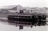 D.C.M.V. <i>Renfrew (II)</i>, the last Clyde chain operated ferry, was diesel-electric and introduced in 1952. Here she is seen crossing the Clyde from Yoker to Renfrew in 1986. The Stone Manganese Marine Limited works is in the background on the north bank. Renfrew Wharf station was not far west of the ferry.<br><br>[Colin Miller //1986]