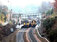 A crisp autumn morning at Polmont in November 2002, with trains for Edinburgh and Dunblane occupying the platforms.<br><br>[John Furnevel 22/11/2002]