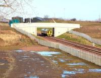 The 1154 Edinburgh Waverley - Tweedbank passing the Biogen anaerobic digestion facility at Millerhill on 15 February 2016 as it approaches the Shawfair stop.<br><br>[John Furnevel 15/02/2016]