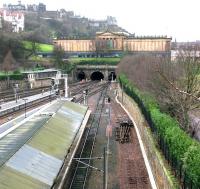 Track lifting underway on the north side of Waverley in January 2006 in preparation for work on the new Balmoral platform. View from a Saturday morning City Tours bus parked on Waverley Bridge (the tour guide was between trips and kindly invited me to use his open top deck for the photograph - having obviously become more and more concerned at my failed attempts to find a foothold on the wall). View is over the west end of platform 19 towards The Mound tunnel.<br><br>[John Furnevel 14/01/2006]