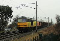 Having missed out several planned loop stops, Colas 60095 brings the Carlisle to Chirk logs through Hest Bank almost ninety minutes early on a wet 19th February 2016. <br><br>[Mark Bartlett 19/02/2016]