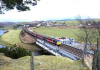 A full set. Virgin liveried class 86 locomotive and stock forming a WCML service passing over Crawford Viaduct on Saturday 22 February 2003. The train is running under temporary speed restrictions due to the extensive maintenance work being carried out on the viaduct at the time.<br><br>[John Furnevel 22/02/2003]