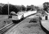 A train photographed shortly after leaving Fort William in the summer of 1970. It has just crossed the River Nevis and is about to pass below the bridge carrying Earl of Inverness Road. [Ref query 39449]<br><br>[John Furnevel 14/07/1970]