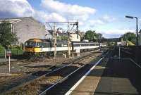 Early morning sunshine highlights 47707 and its push-pull rake in the bay at Dunblane in June 1987. It will shortly propel up to the signal box to reverse and form the 0709 departure to Edinburgh.<br><br>[Mark Dufton /06/1987]