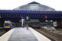An idea of the platform capacities of Glasgow Queen Street High level prior to the planned exensions for EGIP can be gained from this view from 4 weeks before the closure for the Cowlairs Tunnel refurbishment.<br>
On the left at platform 6, a 6 car Class 170 DMU fits with space to spare. In the centre, plaforms 5 & 4 each host a 2 car Class 156, while on the right at platform 3, a 3 car Class 170 just fits with a 2 car DMU behind it. Platform 7 at the extreme left is slightly longer than 6 and platform 2 at the extreme right can accomodate a 6 car unit. Platform 1 is out of shot to the right and can take a 3 car train.<br><br>[Colin McDonald 24/02/2016]