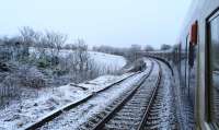 Facing South West at Lugton. The A735 overbridge is just before the signal. First time I've been diverted or delayed on the sleeper - an extra hour in bed!<br><br>[Colin McDonald 17/02/2016]