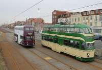 What a contrast. Two Blackpool <I>Balloons</I>, both on driver training duties, meet at Bispham on 29th February 2016. 717 <I>Walter Luff</I> on the right is in almost original condition with roof lights, sun visors, skirts and tip seats. 711 is heavily modified with no roof lights or skirts but rubber surround <I>bus windows</I> fitted. Most significantly 711 is also a <I>wide body</I> with the entrances extended so that it can operate from the new tram stops when required to supplement the <I>Flexity</I> fleet. <br><br>[Mark Bartlett 29/02/2016]