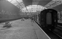 A service from Fort William has just arrived in platform 5 at Glasgow Queen Street in June 1986. It is headed by 37413. To the left in platform 7 is the 13.00 push-pull service to Edinburgh.<br><br>[Mark Dufton /06/1986]