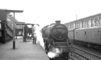 The 8.55am ex-Blackpool North stands at Carlisle's platform 1 on Saturday 14 August 1965 behind Kingmoor Black 5 no 45120. The train is preparing to restart its journey north to Glasgow Central, running via Kilmarnock and Paisley Gilmour Street.<br><br>[K A Gray 14/08/1965]