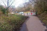 A mile after leaving the terminus, trains on the Penicuik Railway reached the single wooden platform at Eskbridge. The station here closed in 1930 and any remains are buried beneath the mound on the left. The trackbed now forms part of the popular Penicuik – Dalkeith Walkway. Scene looking north towards Auchendinny on 27 February 2016.<br><br>[John Furnevel 27/02/2016]